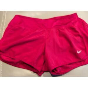Nike 3 inch red running shirt with liner and internal draw string.